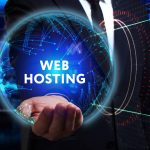 A businessman holding a glowing digital globe with the text "WEB HOSTING" centered inside a network of blue data connections.